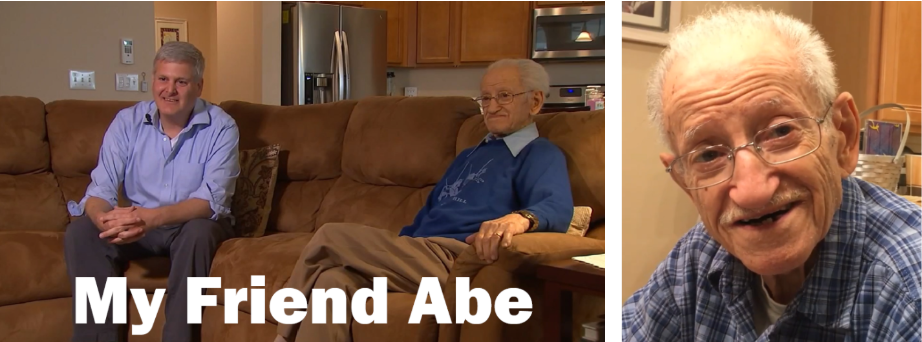 Steven Goldberg and Abe Piasek sit on a couch. 